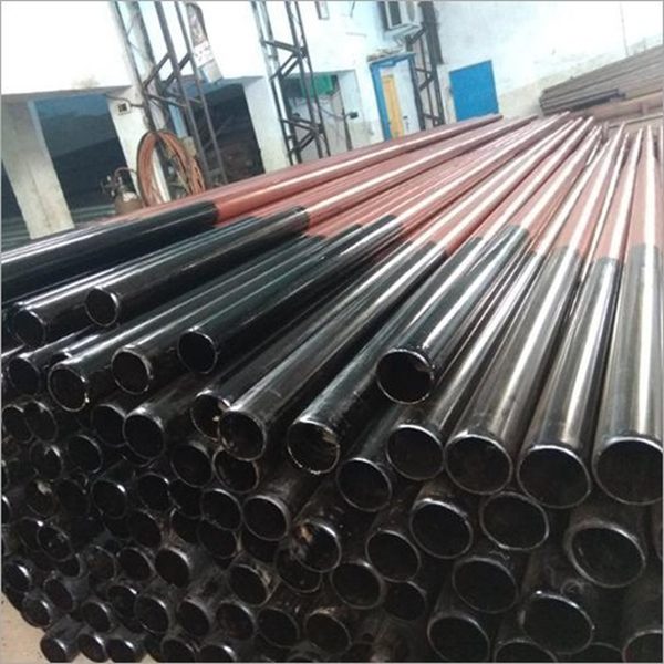 Steel tubular poles stacked in a yard