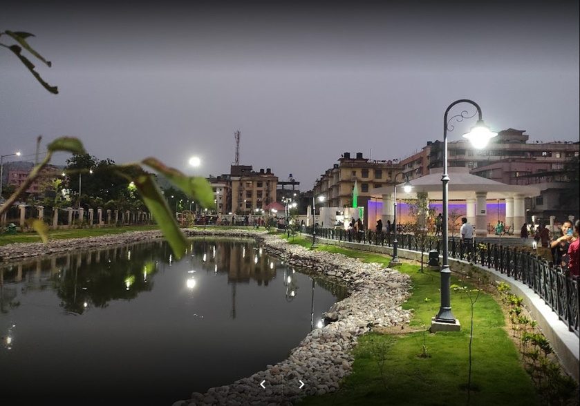 Lamp posts along a lake edge at Adabari Park