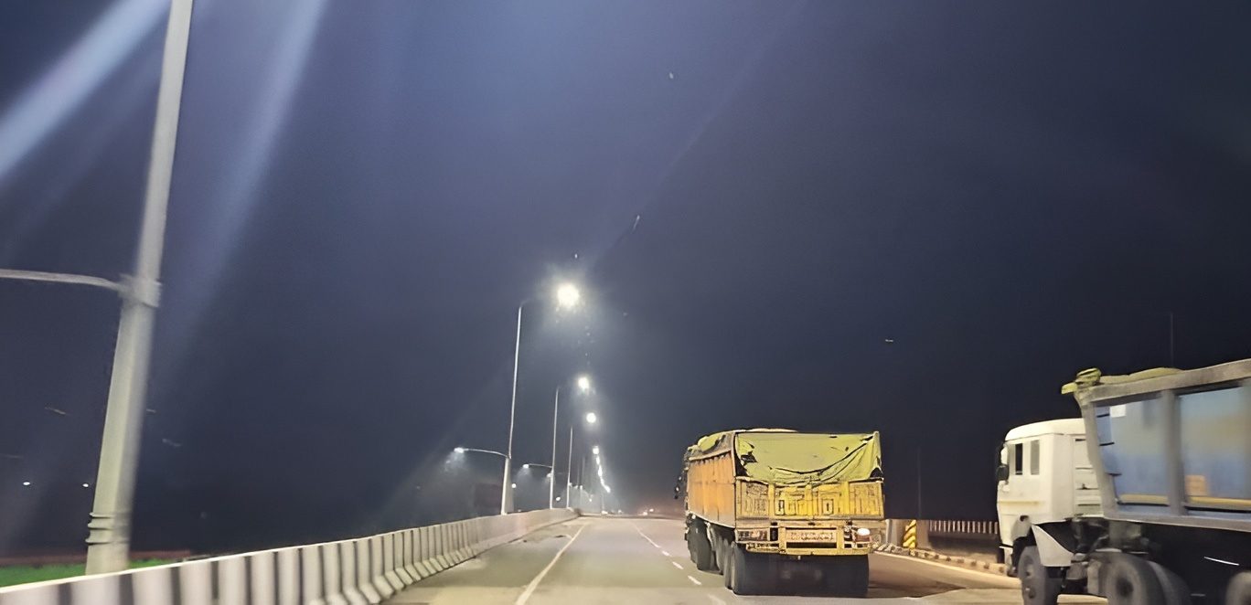 Street lights illuminating a highway at night